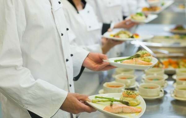 Chef-20holding-20salmon-20dishes-20standing-20in-20a-20row-20with-20colleagues-506407-edited1gDJMR7M2pVPI